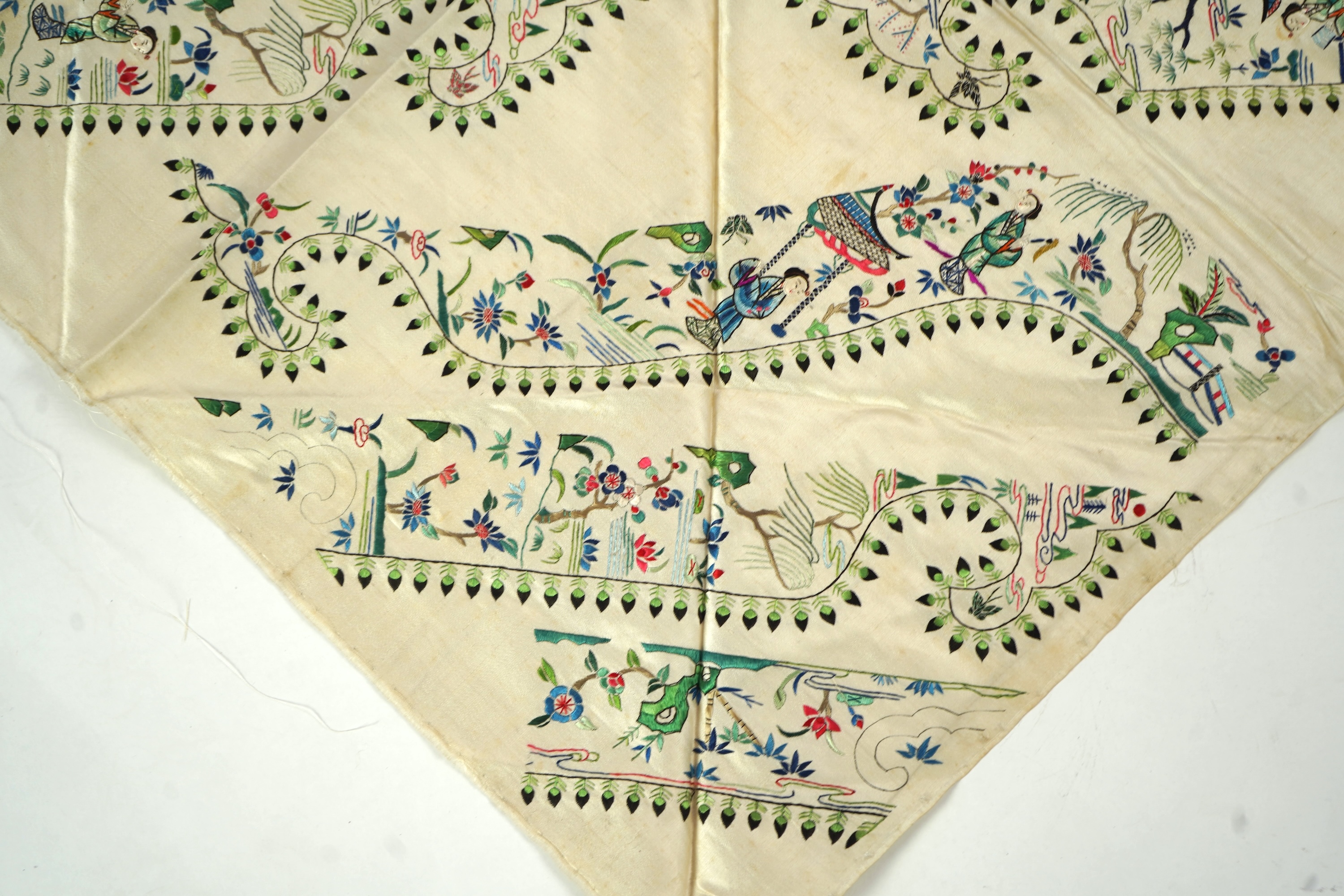 A Chinese embroidered silk panel of uncut robe borders, eleven similar sleeve panels and two other items, late Qing dynasty